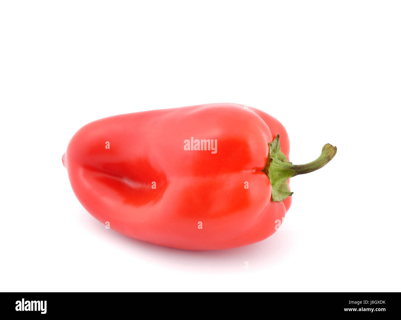 Red sweet peppers on a white background Stock Photo - Alamy