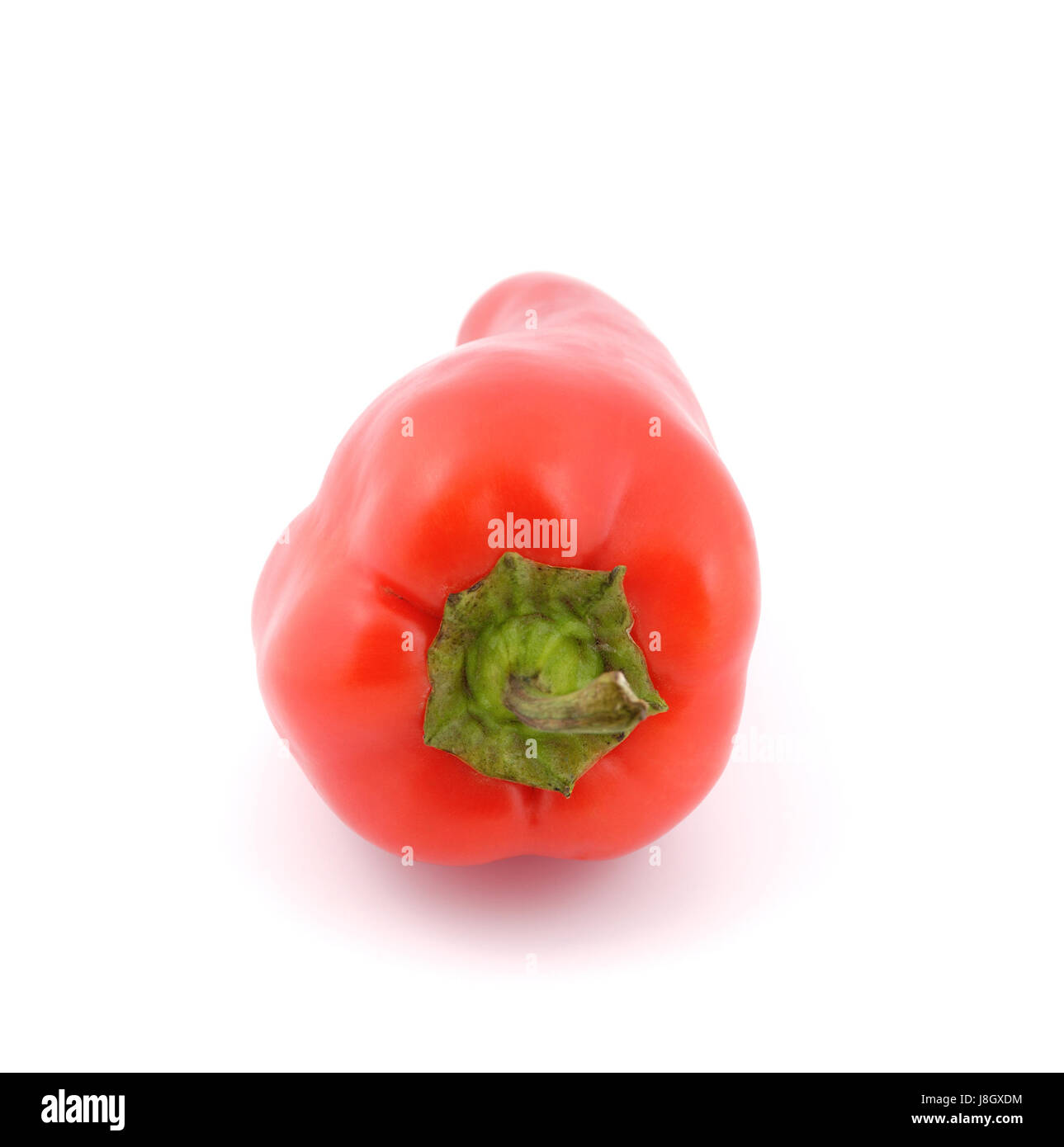 Red sweet peppers on a white background Stock Photo - Alamy