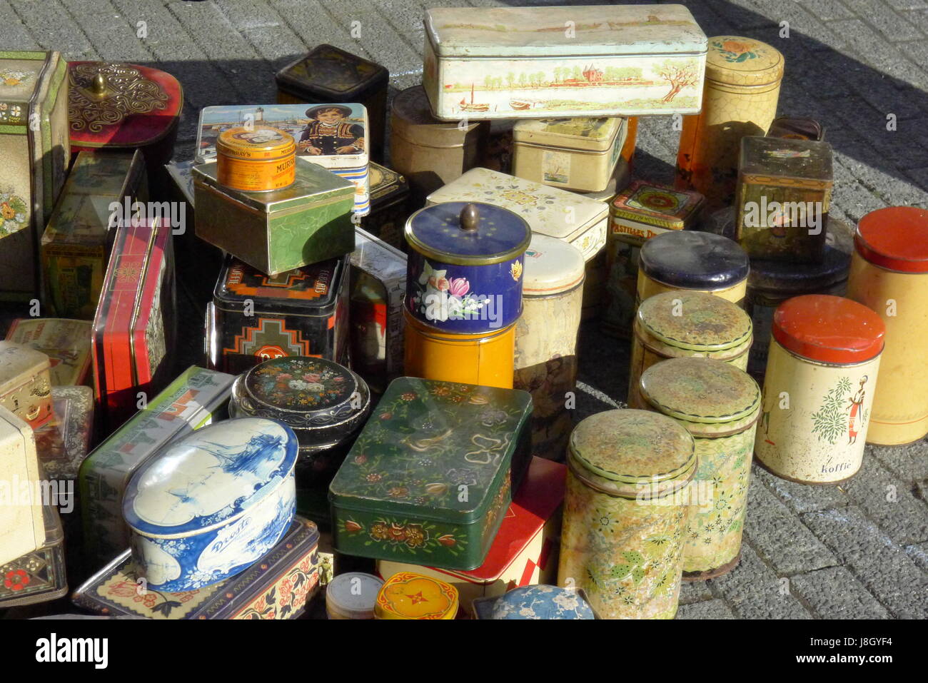 A wide collection of tin cans in various shapes and sizes standing out