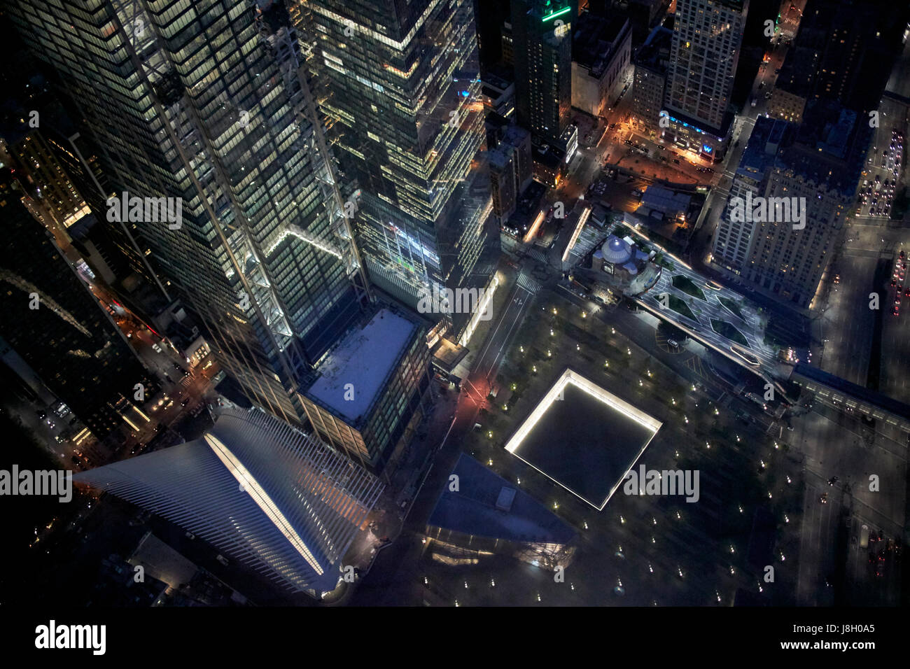 aerial night view of the national september 11 memorial museum and oculus transport hub New York City USA Stock Photo