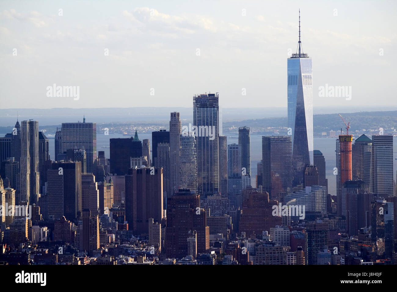 view of lower manhattan with one world trade center tower and financial district skyline New York City USA Stock Photo