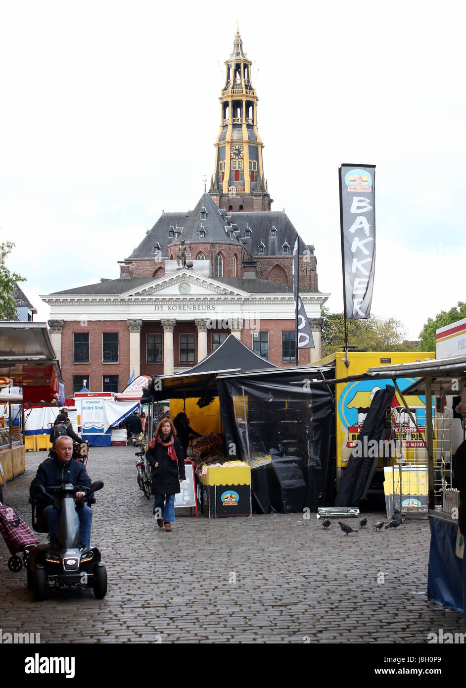Market day on the large medieval Vismarkt square, city of Groningen, The Netherlands. In background Korenbeurs & Der Aa Kerk (Aa church) Stock Photo