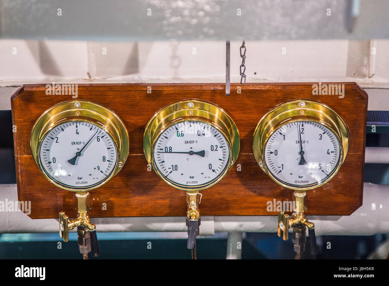 Old bronze ship instruments at a ship on the german river elbe Stock ...