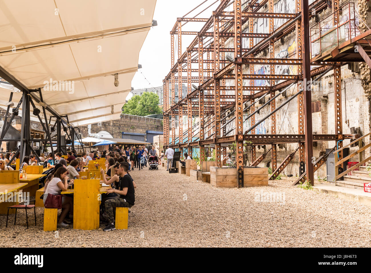 Mercato Metropolitano, a disused paper factory, in Elephant and Castle, is now a market space and lifestyle hub home to food stalls, shops and bars Stock Photo