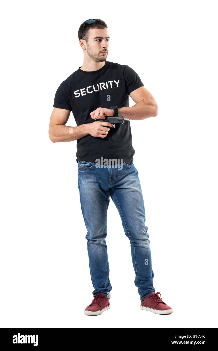 Undercover policeman cocking gun looking away. Full body length portrait isolated on white studio background. Stock Photo