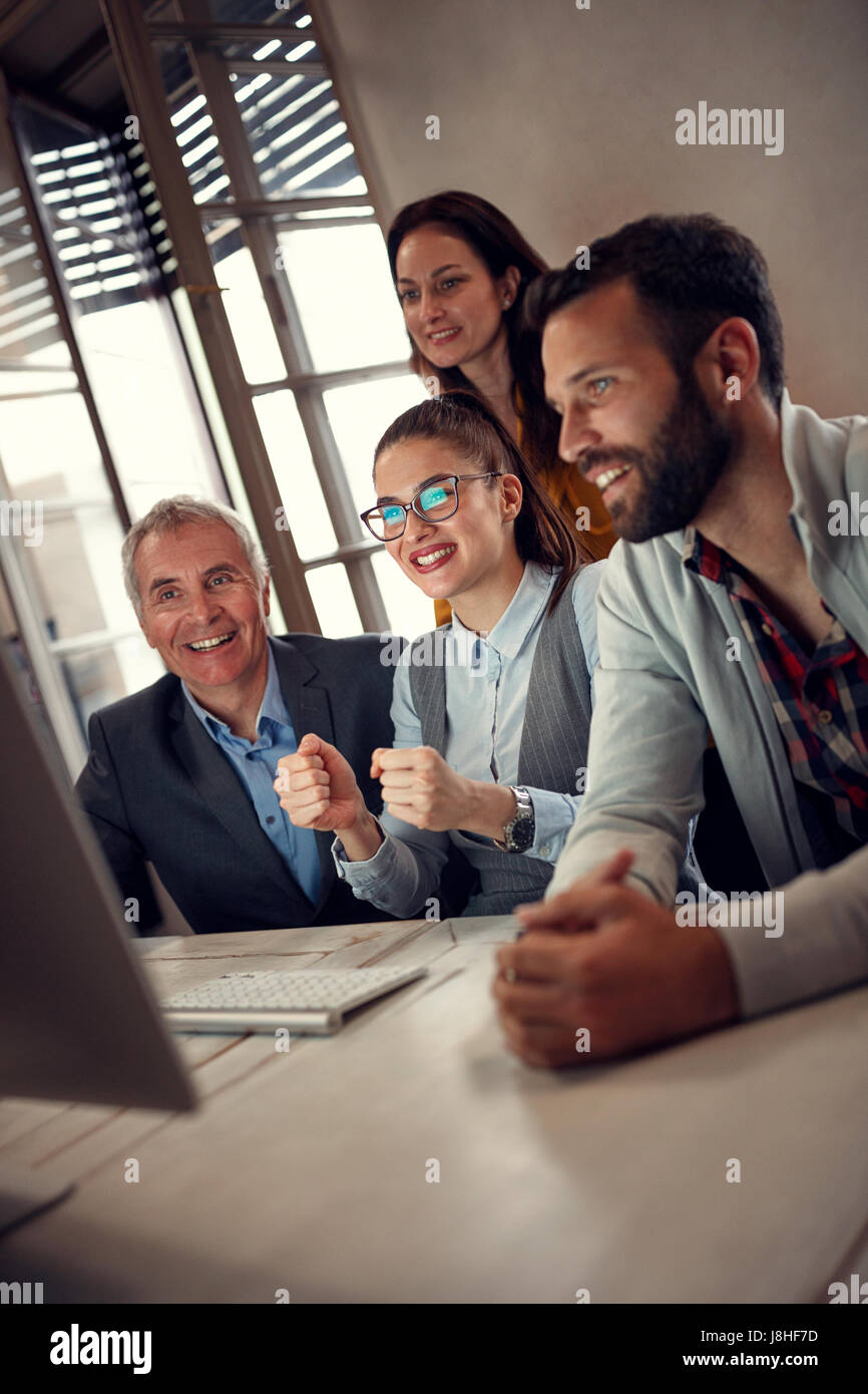 successful teamwork-Business workers cheering on meeting Stock Photo