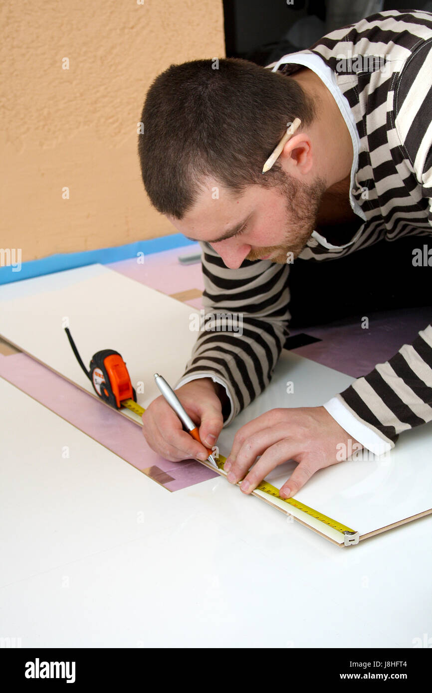 young man laid laminate Stock Photo - Alamy