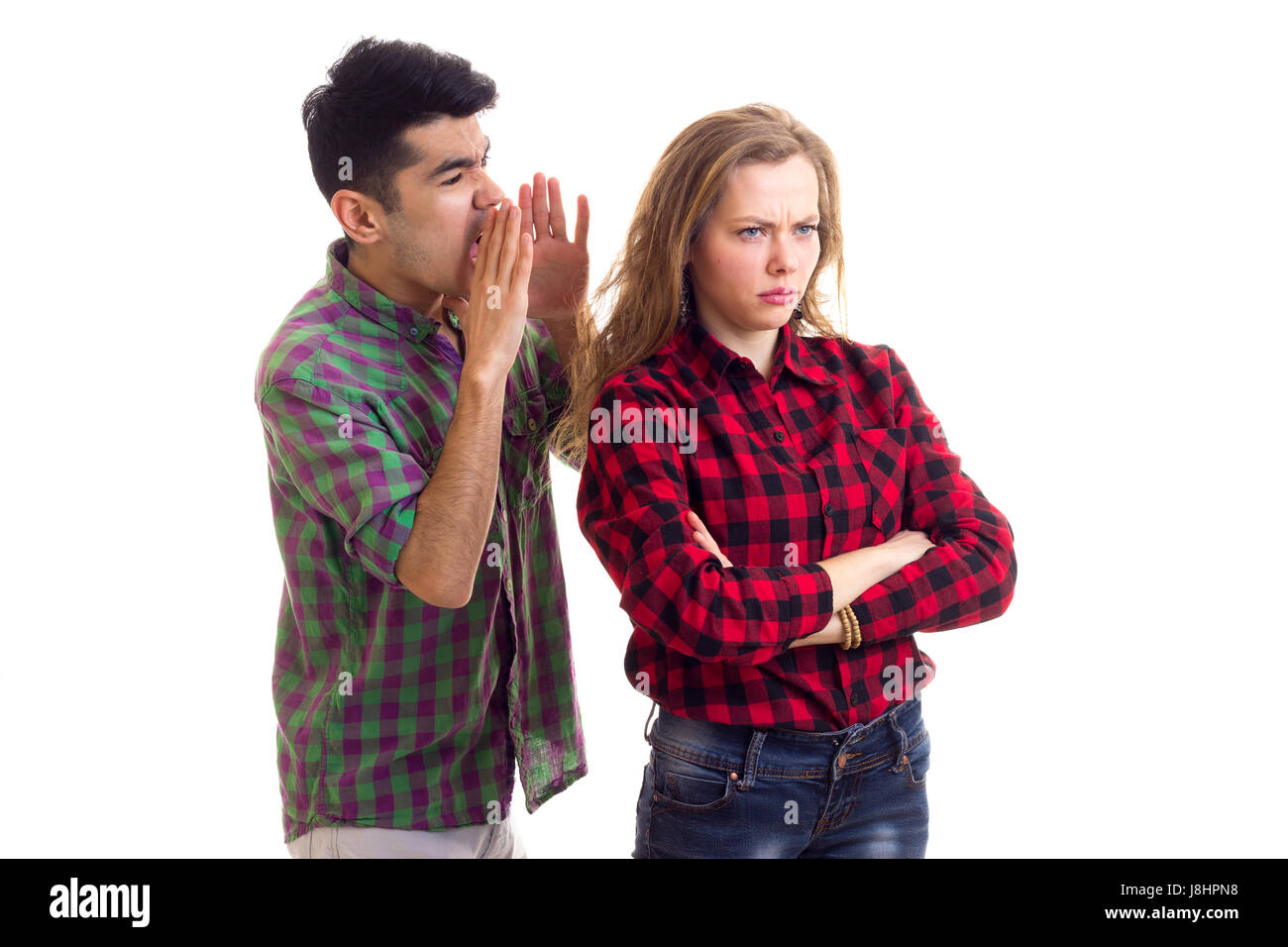 Young couple in plaid shirts arguing  Stock Photo