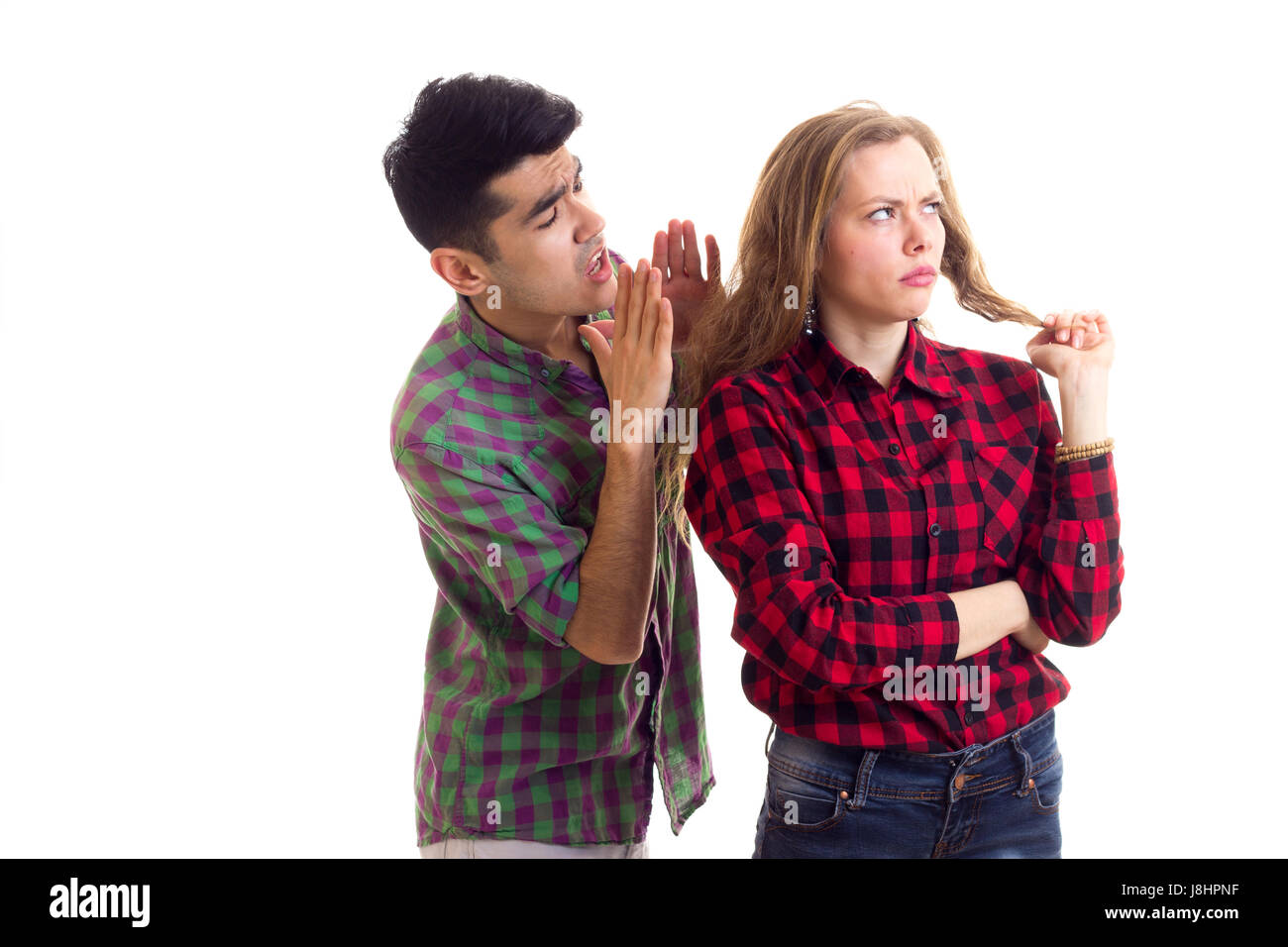 Young couple in plaid shirts arguing  Stock Photo