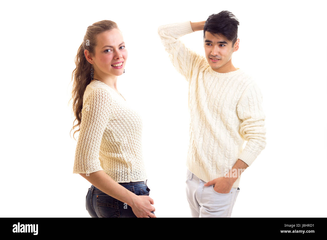 Young couple in white sweaters  Stock Photo