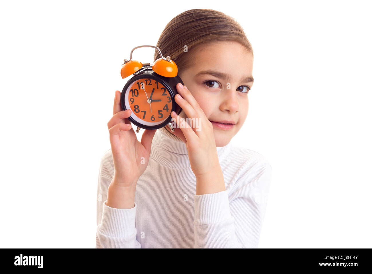 Little girl holding a clock Stock Photo Alamy