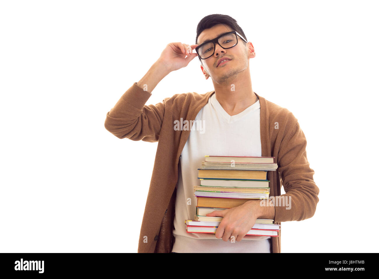 Young man in glasses with books Stock Photo