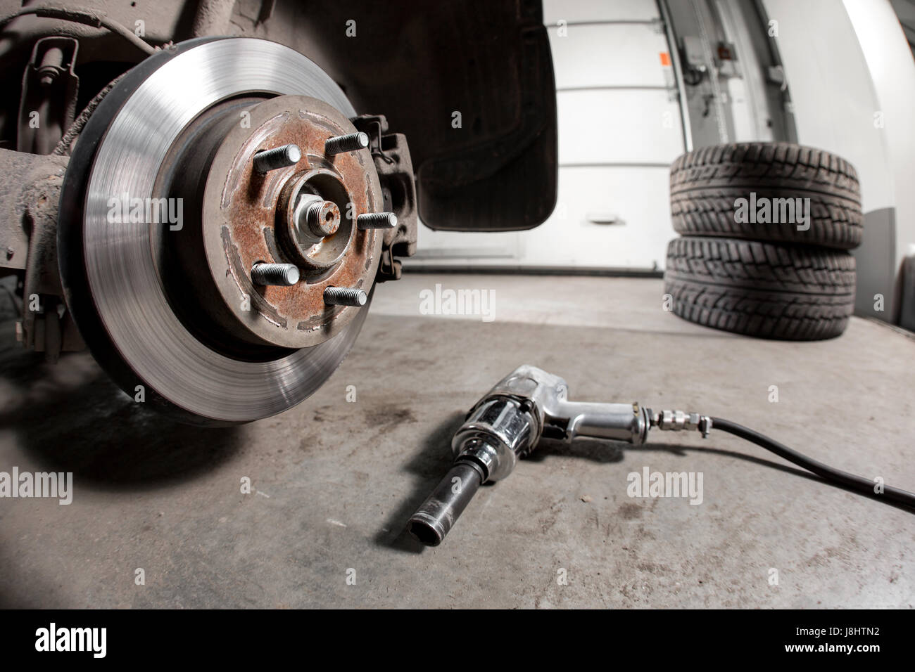 Closeup disc brake of the vehicle for repair. shot wheel, the tool for