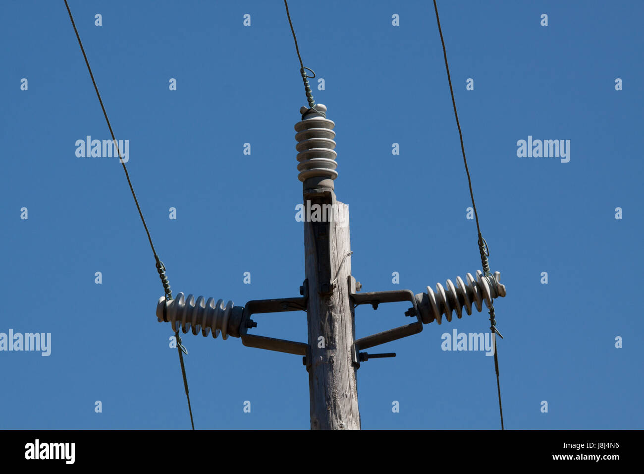 old wood electricity pylon with insulators Stock Photo Alamy