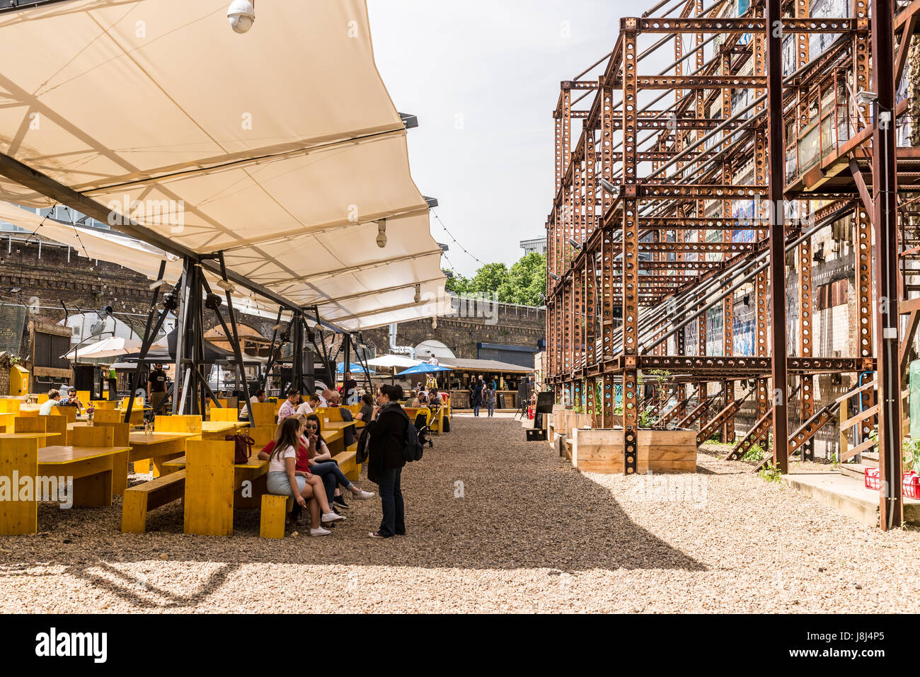 Mercato Metropolitano, a disused paper factory, in Elephant and Castle, is now a market space and lifestyle hub home to food stalls, shops and bars Stock Photo