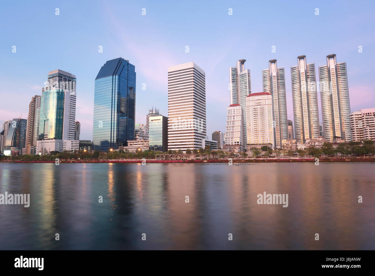 Skyscraper city in downtown of Benjakitti Park at Bangkok Thailand,cityscape in twilight time. Stock Photo