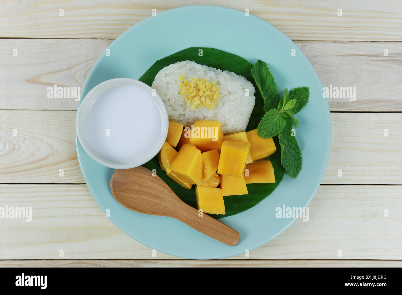 mango and sticky rice in blue dish is popular traditional dessert of