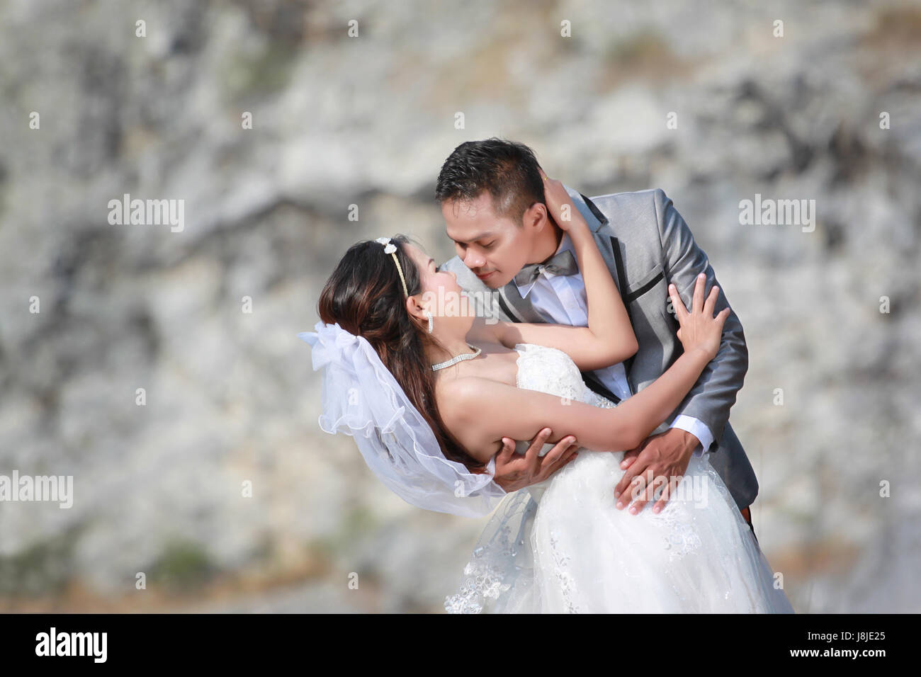 Asian couples photos of pre wedding concept of love and Marriage in nature  outdoor on rocky mountain background Stock Photo - Alamy
