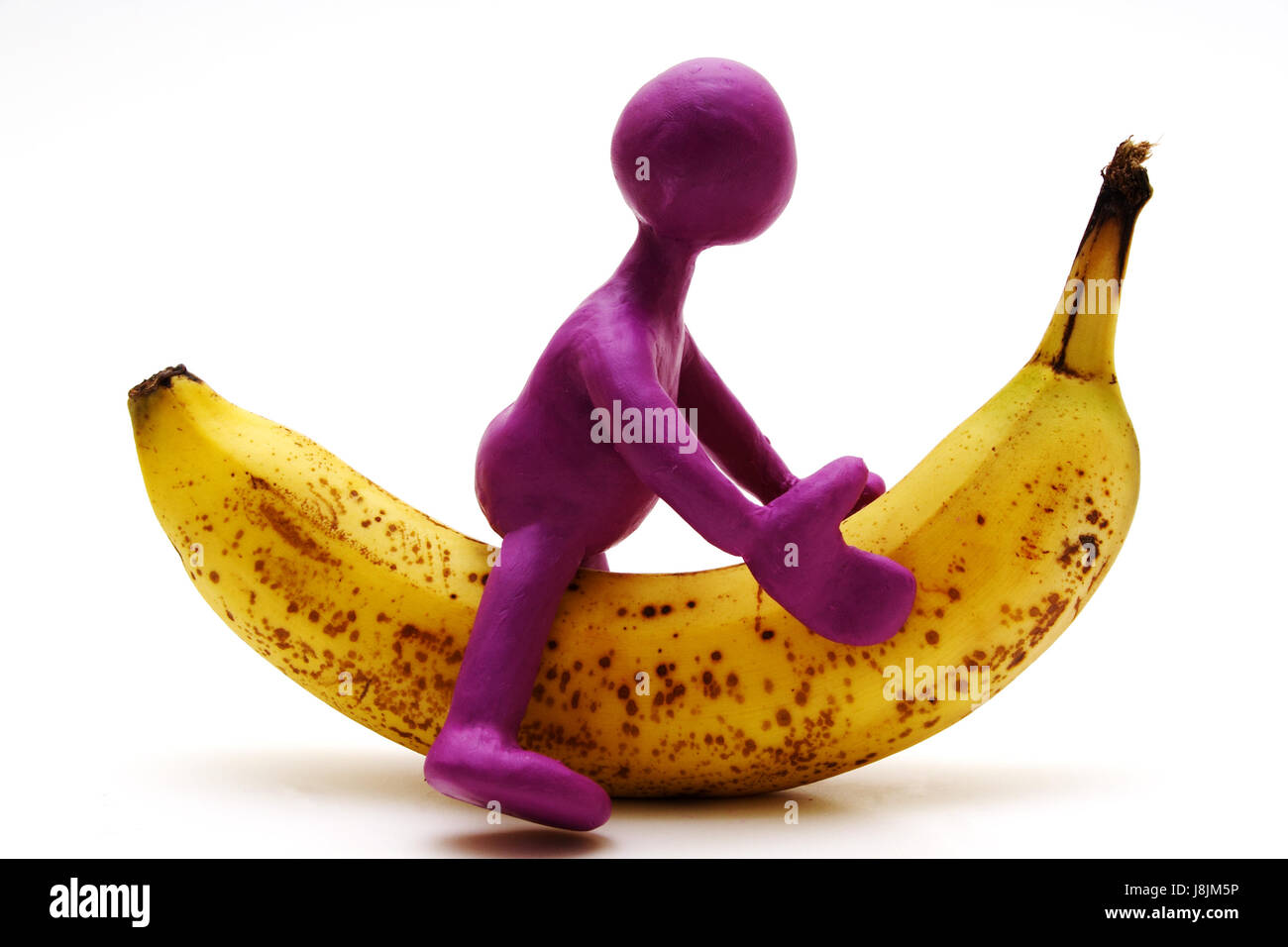 purple, riding, banana, up, on, puppet, plasticine, of, from, indicate, show, Stock Photo