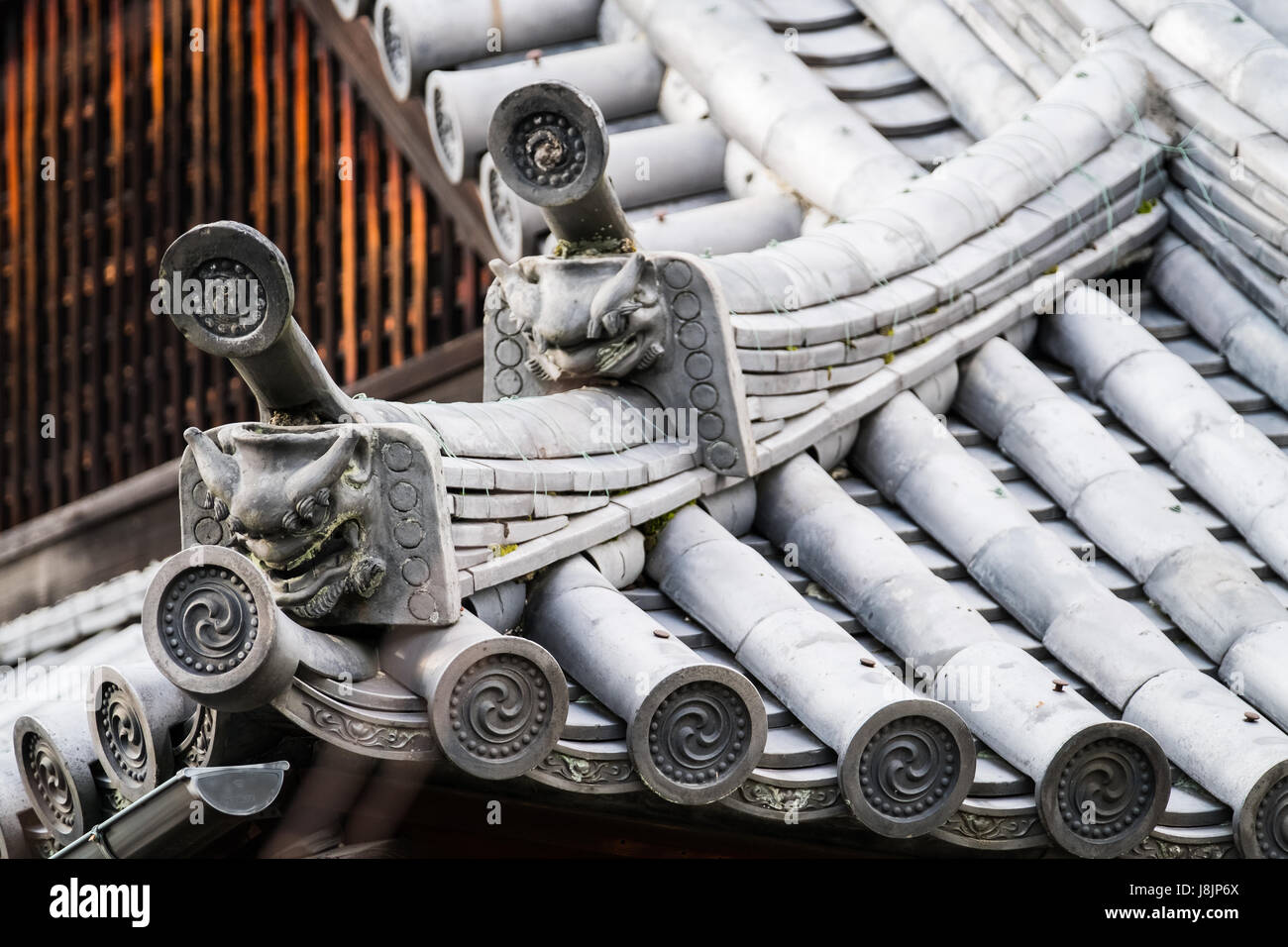 Traditional Japanese architecture and rooftop gargoyles. Stock Photo