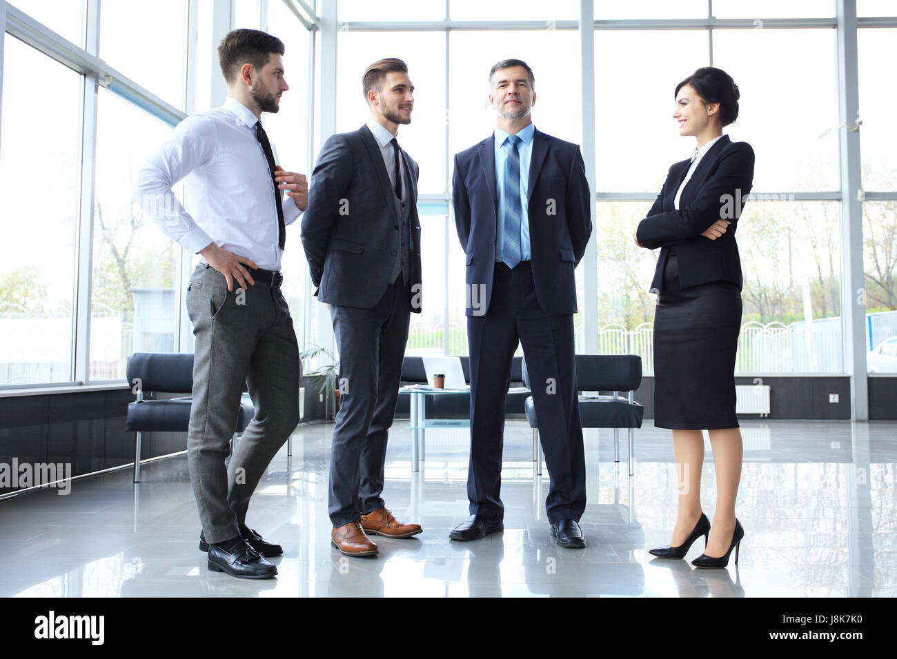 Happy smiling business team in office - business concept Stock Photo ...