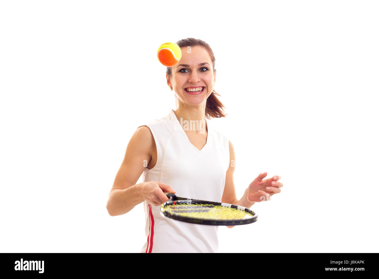 Woman playing with tennis racquet Stock Photo - Alamy