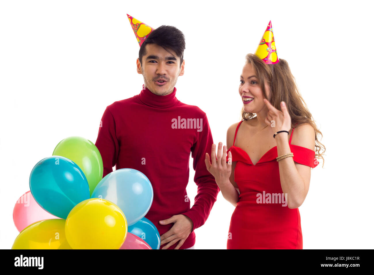Young couple with balloons Stock Photo - Alamy