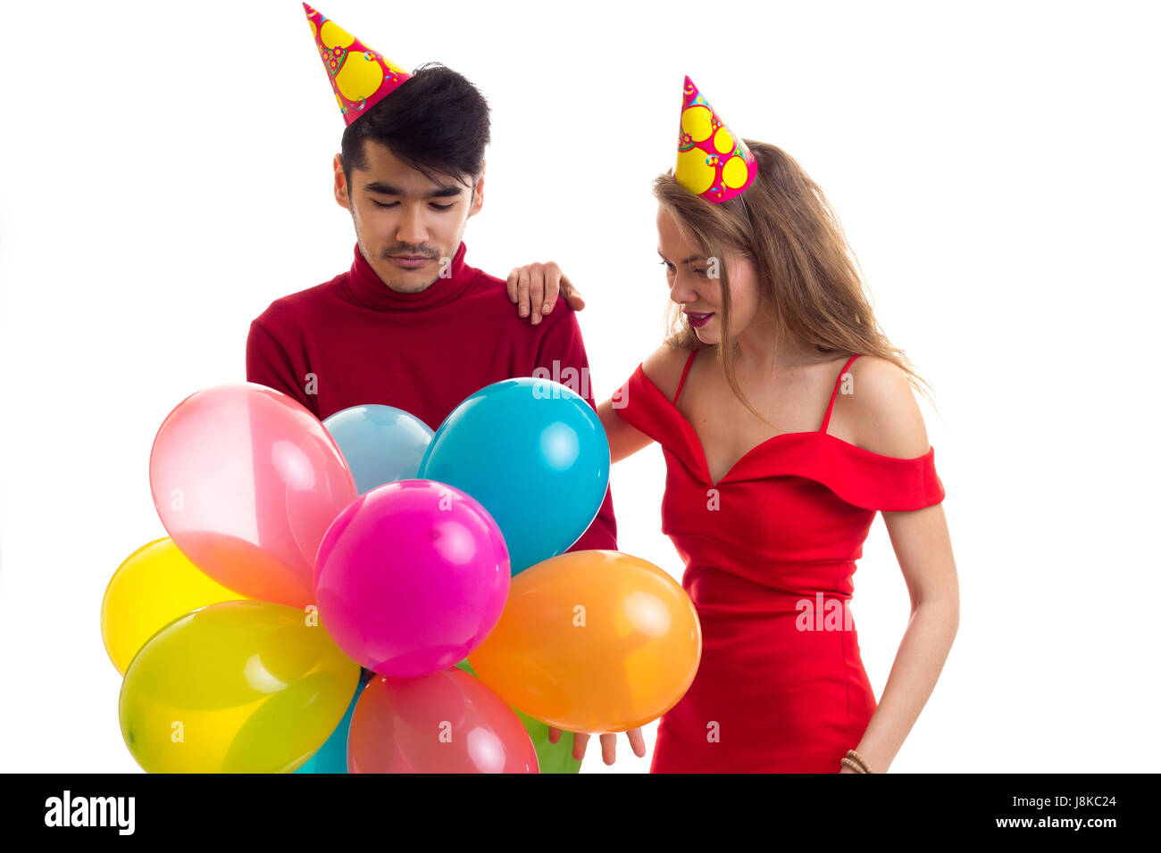 Young couple with balloons Stock Photo - Alamy
