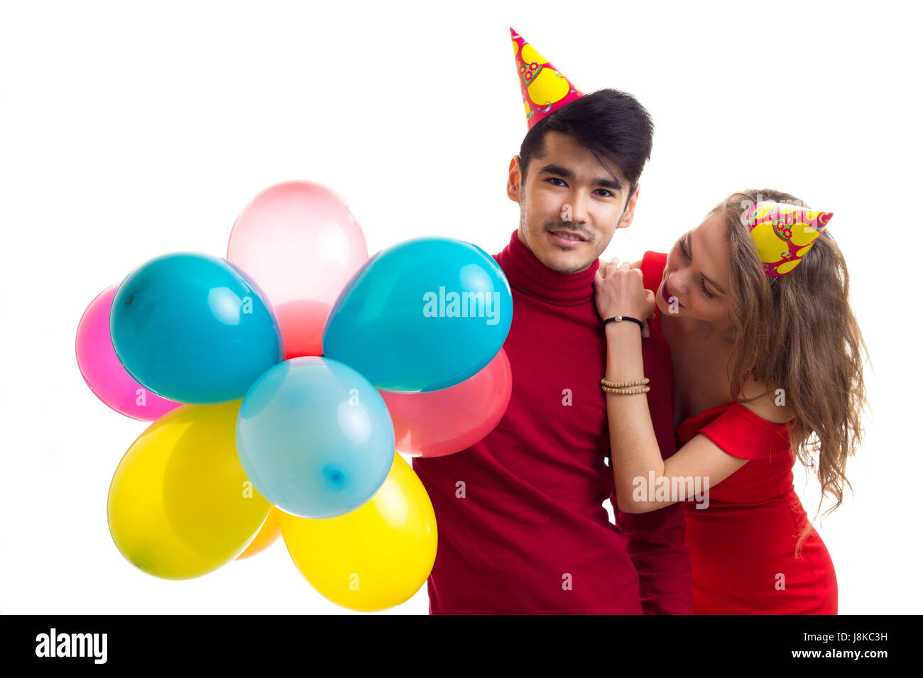 Young couple with balloons Stock Photo - Alamy