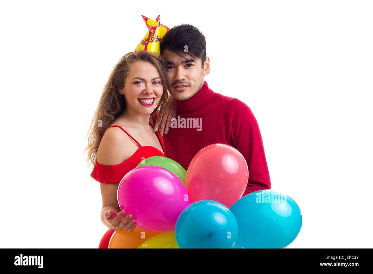 Young couple with balloons Stock Photo - Alamy
