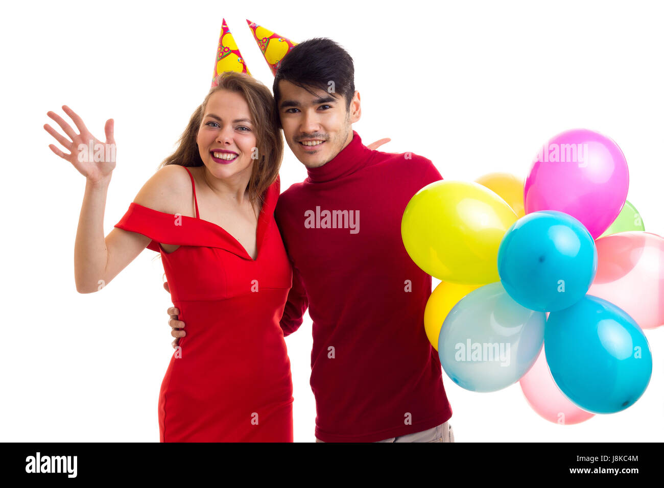 Young couple with balloons Stock Photo - Alamy