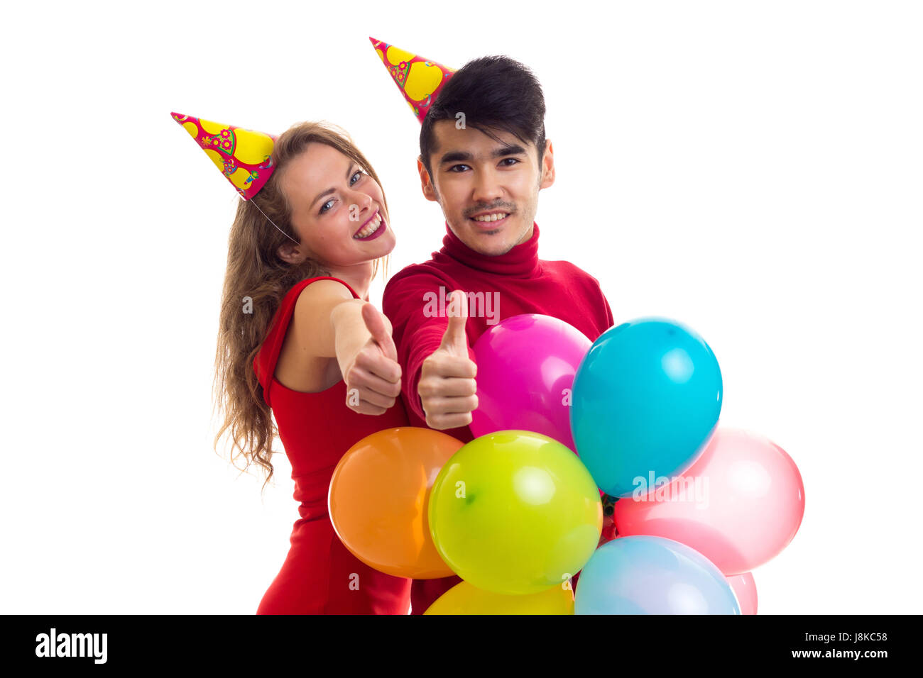 Young couple with balloons Stock Photo - Alamy