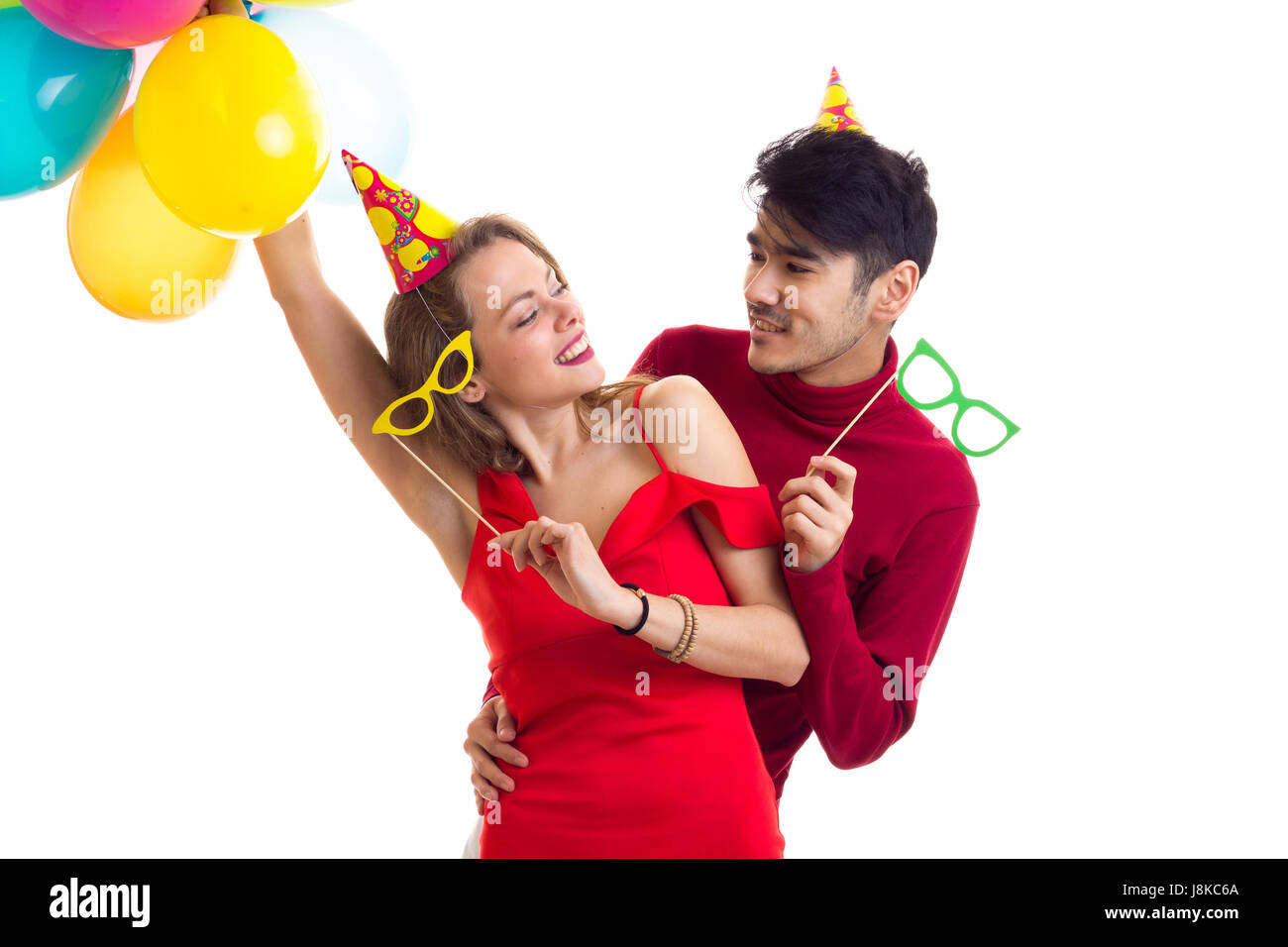Young couple with balloons Stock Photo - Alamy