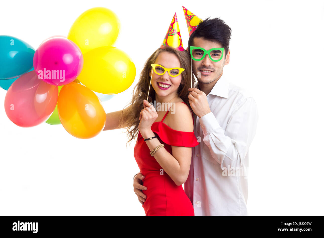 Young couple with balloons Stock Photo - Alamy