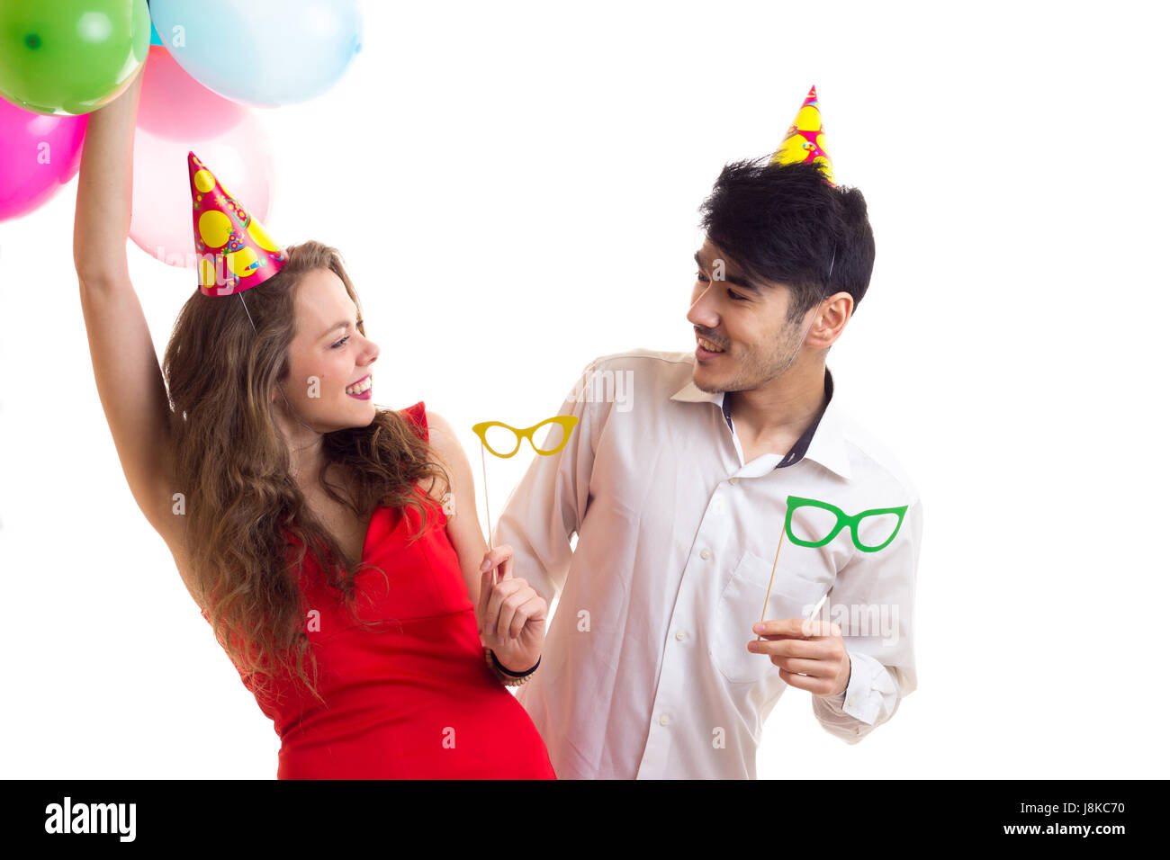 Young couple with balloons Stock Photo - Alamy