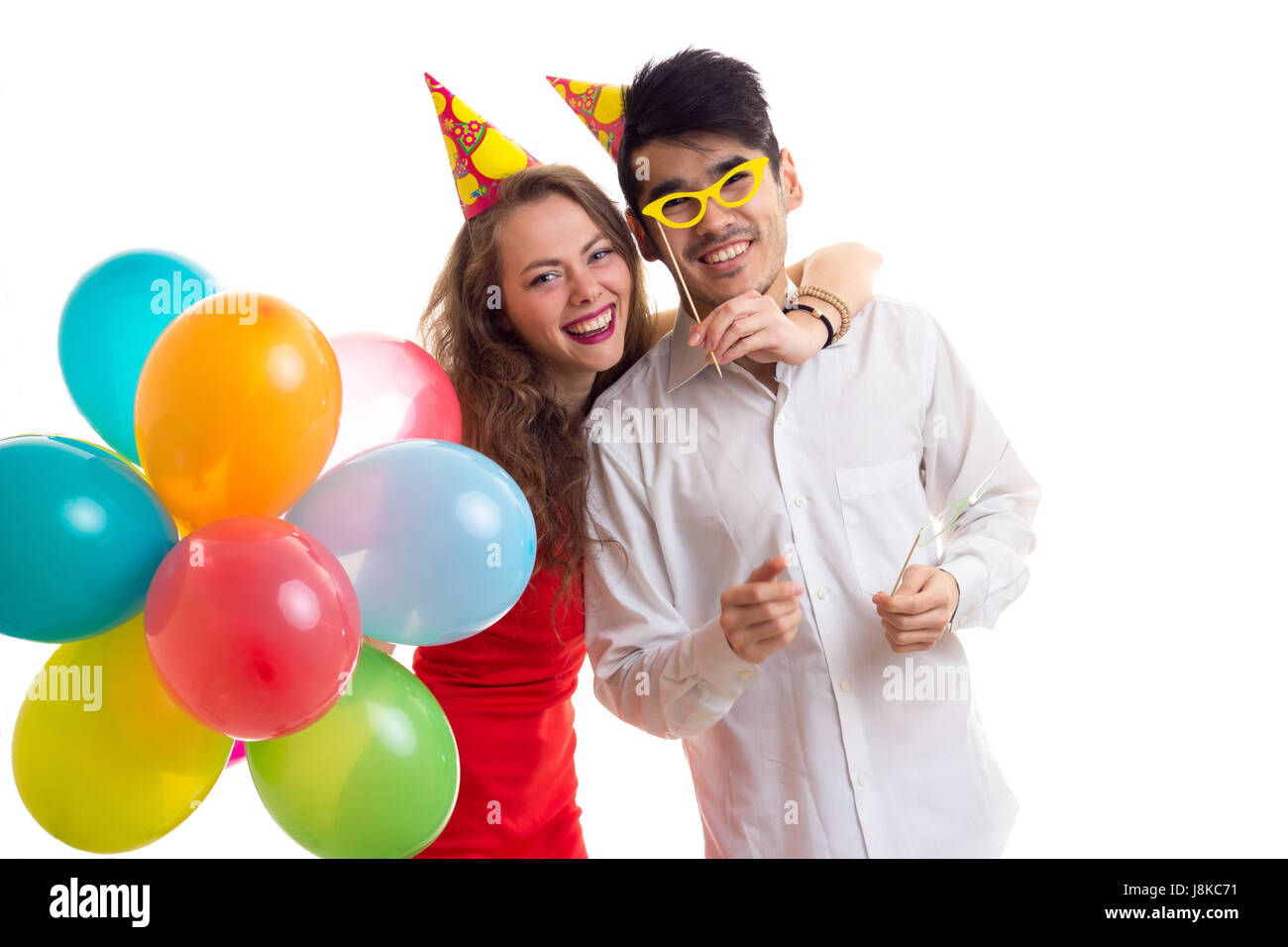 Young couple with balloons Stock Photo - Alamy