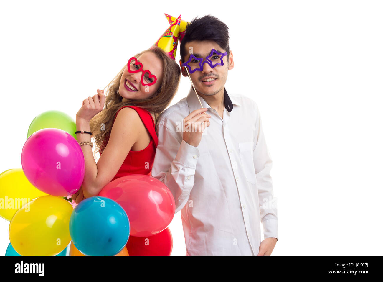 Young couple with balloons Stock Photo - Alamy