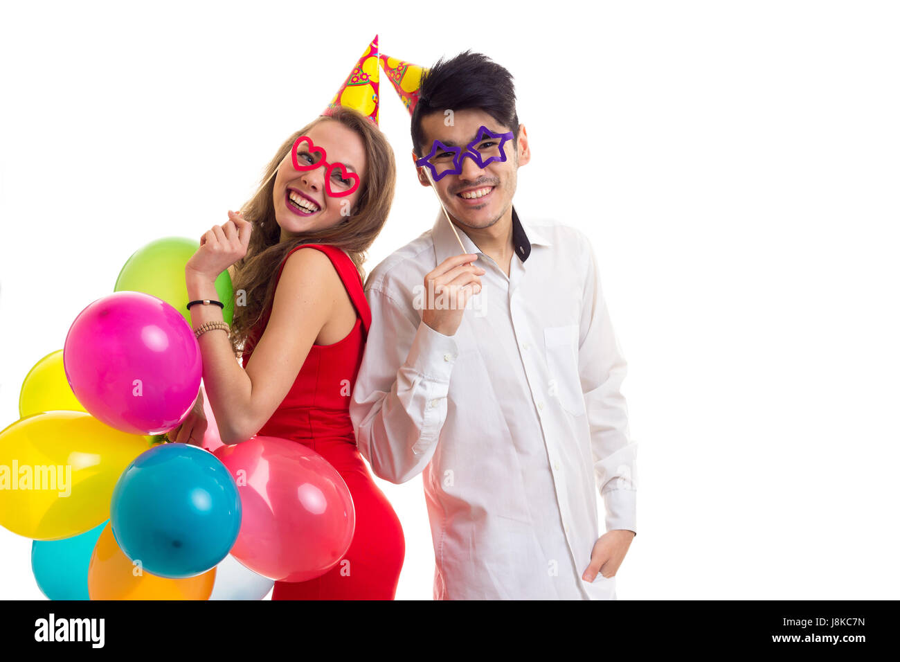 Young couple with balloons Stock Photo - Alamy