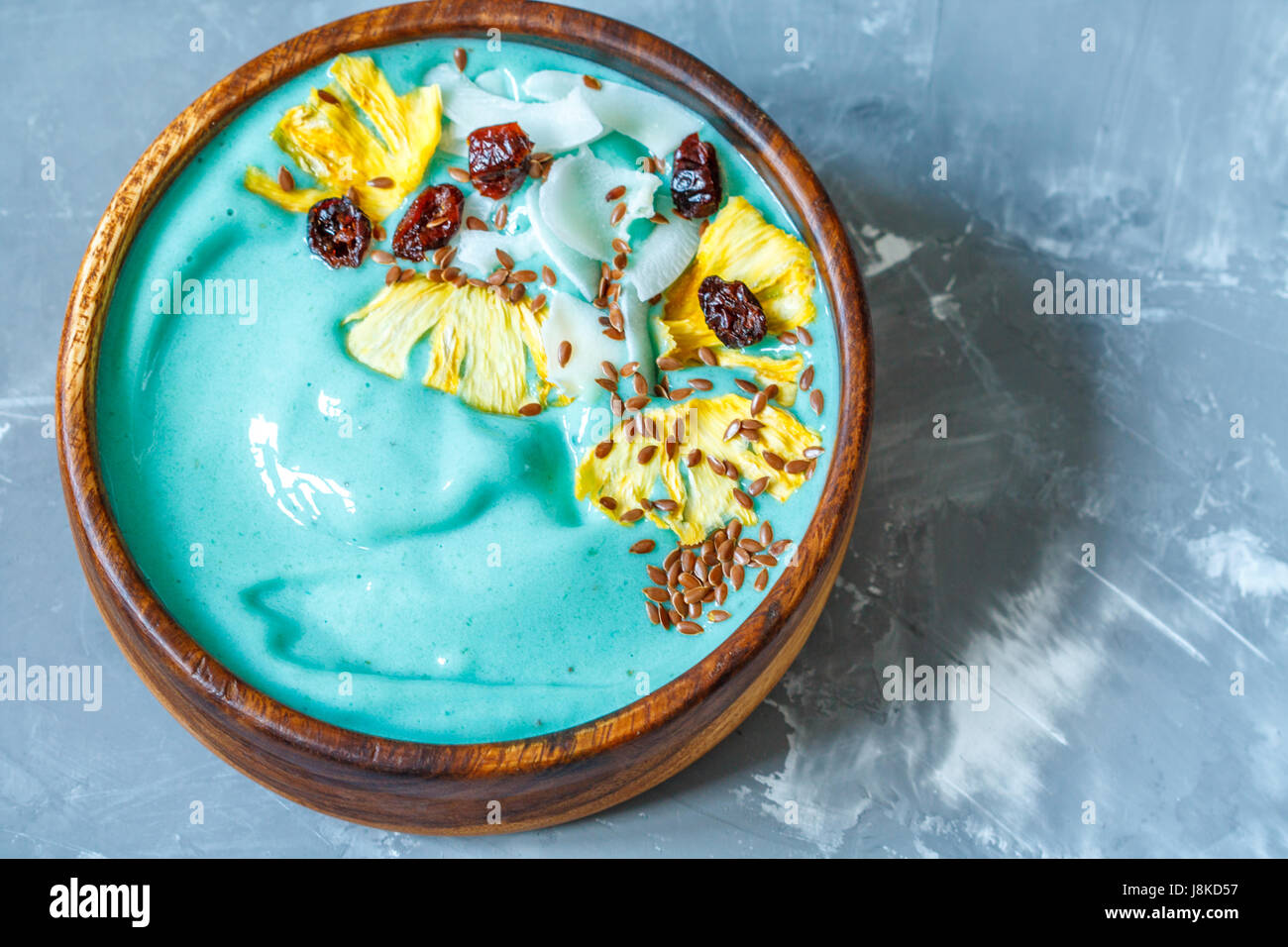Blue spirulina smoothie bowl with pineapple and coconut. Love for a