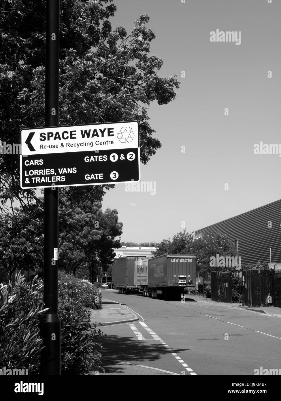 Space Waye recycling centre roadside direction sign mounted on lamppost Stock Photo