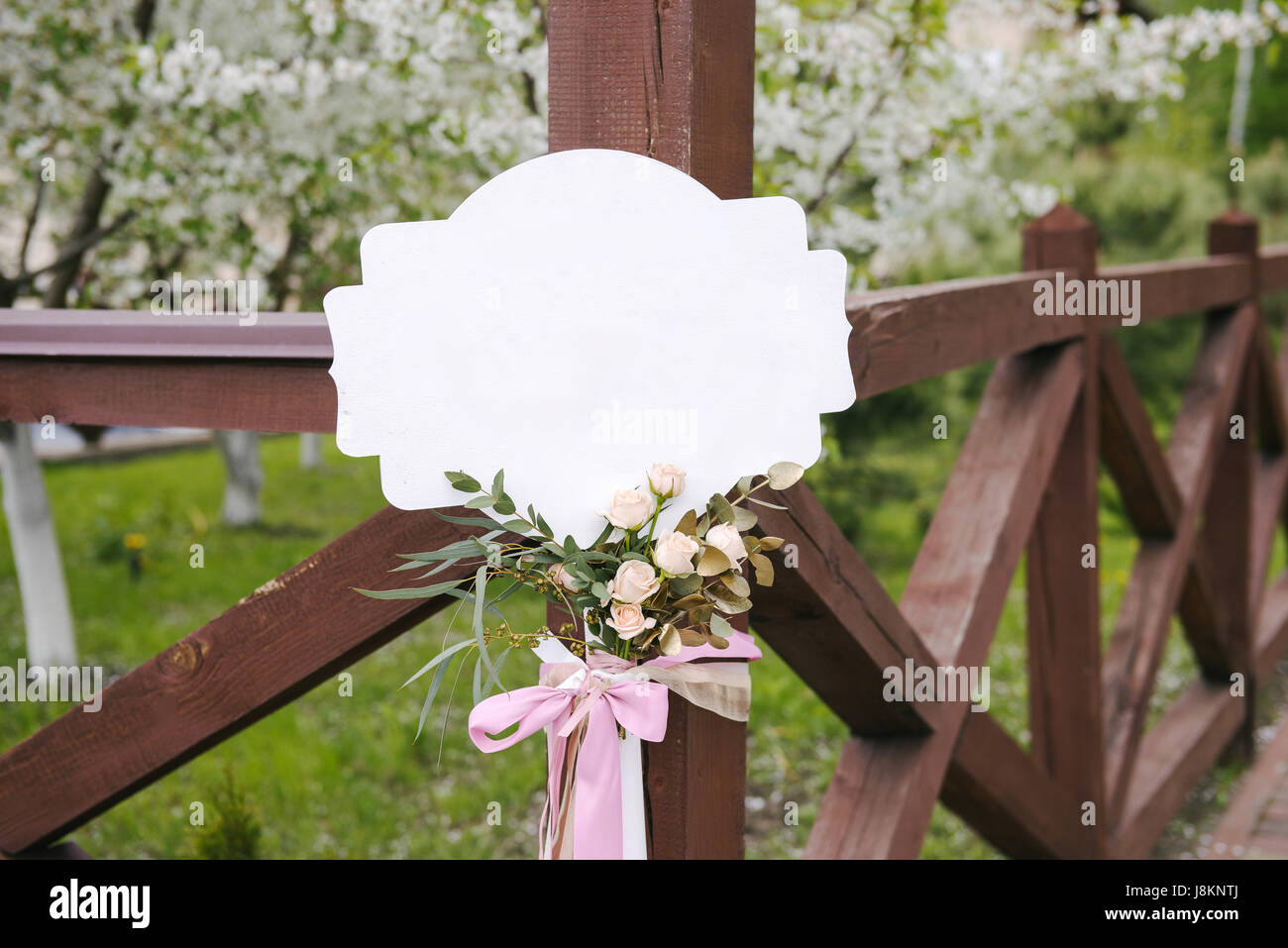Accessory, white nameboard with nice boutonniere and bow Stock Photo