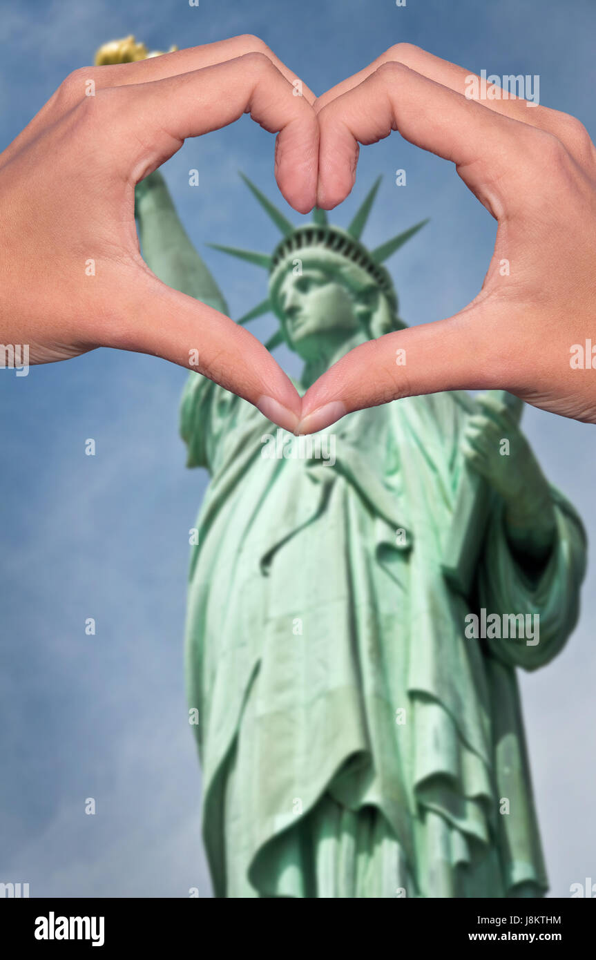 Statue of liberty and hands forming a heart, New York love and travel concept Stock Photo