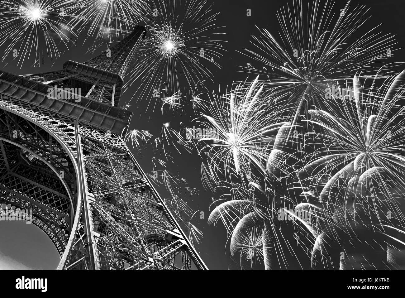 Eiffel tower at night with fireworks, french celebration and party, black and white image, Paris France Stock Photo