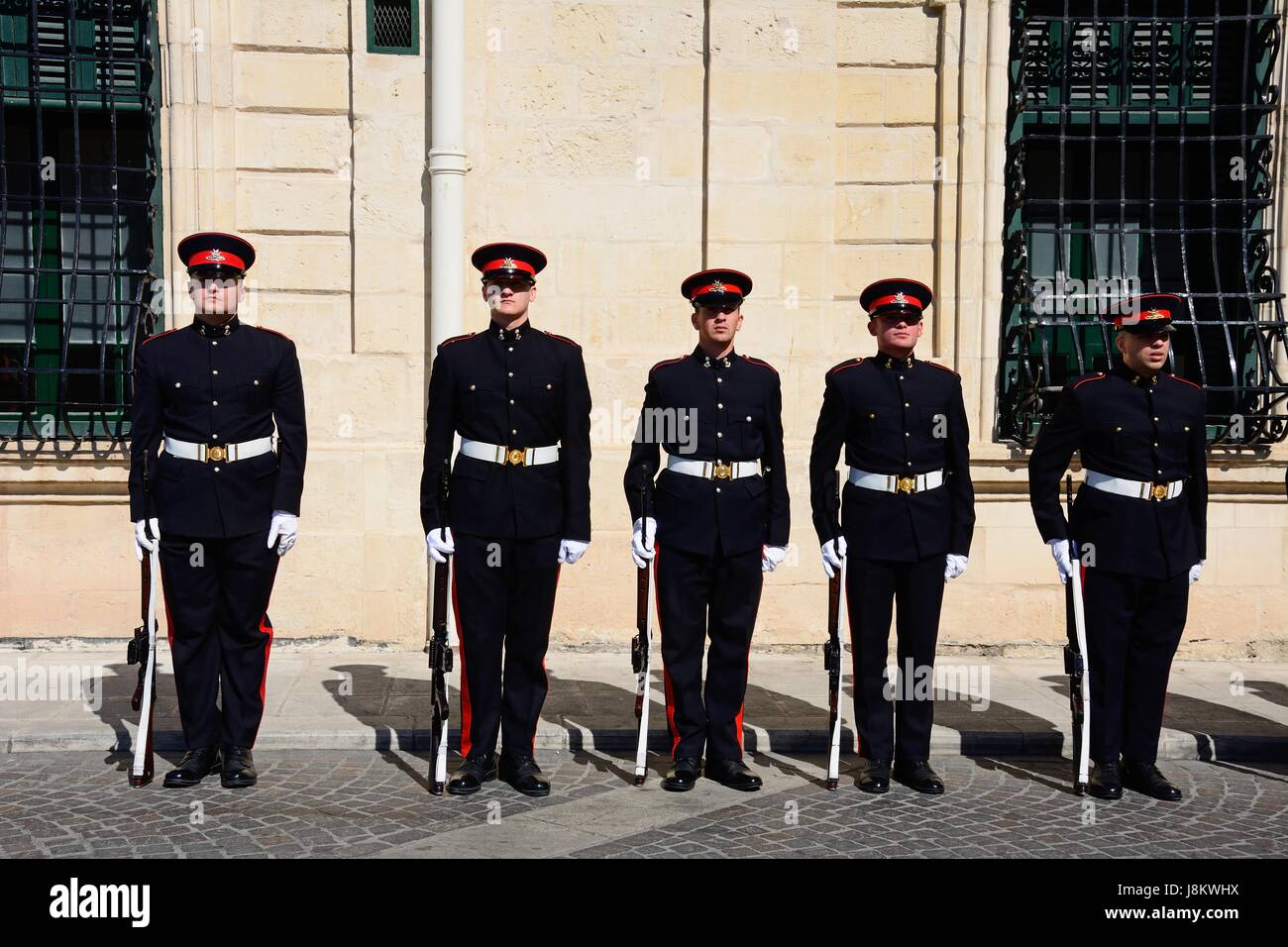 Uniformed soldiers on parade outside the Auberge de Castille for a European Union conference in Castille Square, Valletta, Malta, Europe. Stock Photo
