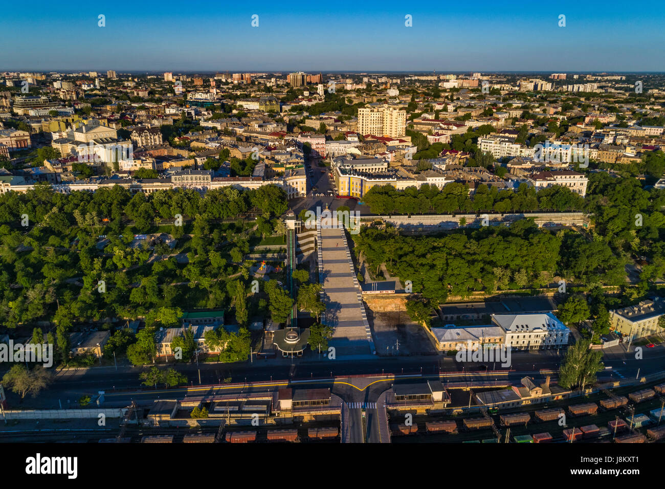Elevated drone image of the Potemkin Stairs and Prymorski Boulevard with Istanbul Pakr and the Odessa Skyline behind. Taken at sunrise on a summer mor Stock Photo