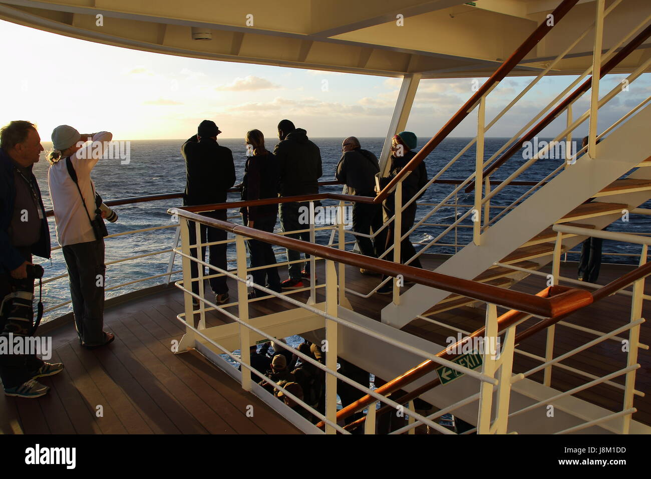 Cape Town South Africa - passengers on the aft deck of a cruise liner watch the departure from Table Bay Harbor Stock Photo