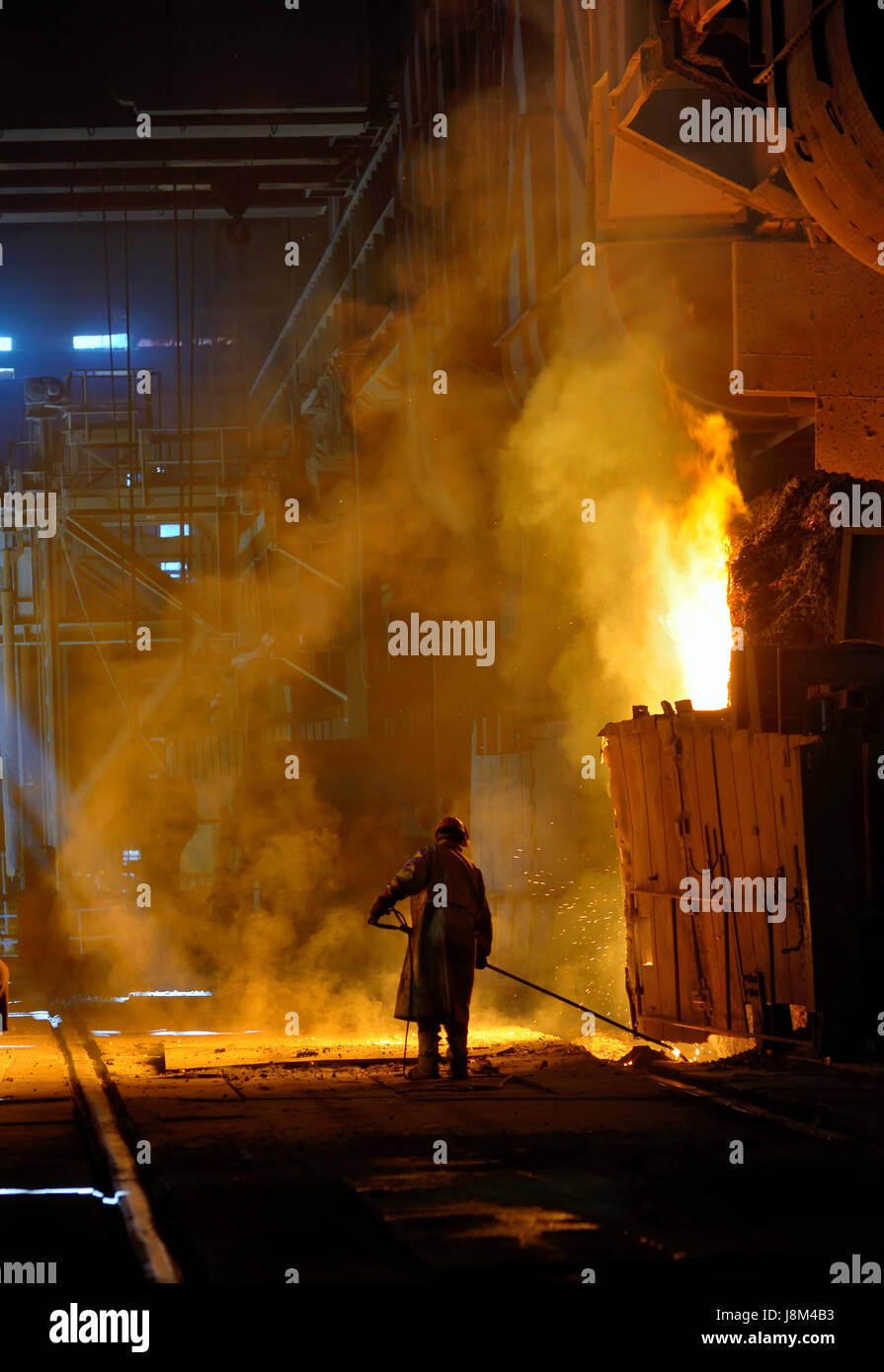 steel worker near oven  inside of steel plant Stock Photo
