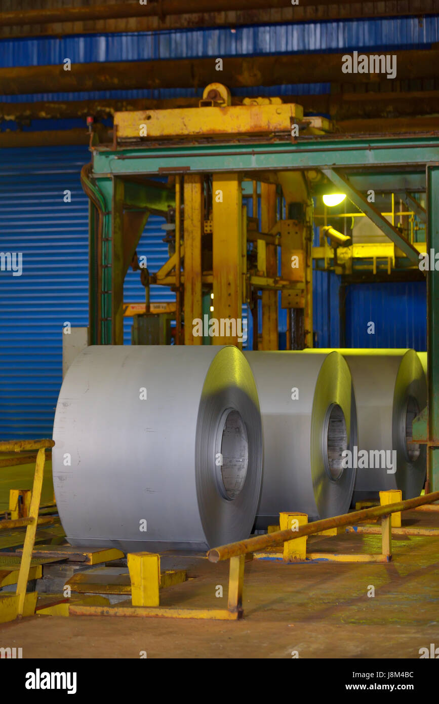 Rolls of metal coil inside of steel plant Stock Photo