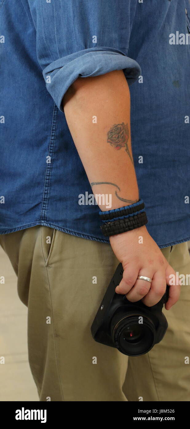 Man with camera and camera tattoo on the arm hi-res stock photography and  images - Page 2 - Alamy
