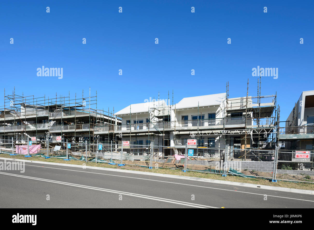 A row of new houses being built, Shell Cove, New South Wales, NSW, Australia Stock Photo